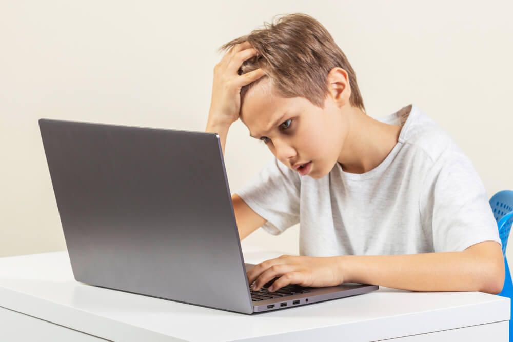 kid on computer